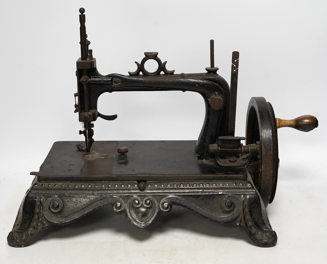 A late 19th century Atlas Brunonia sewing machine with decorative cast iron base. Condition - fair